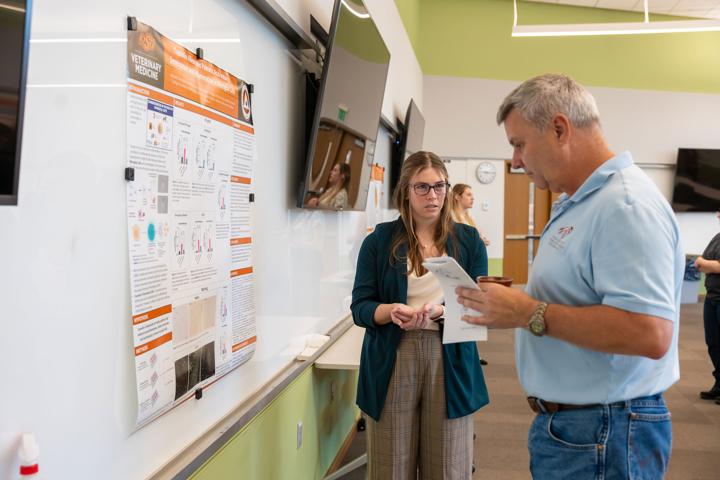 Student making a presentation during VetMed Poster Day