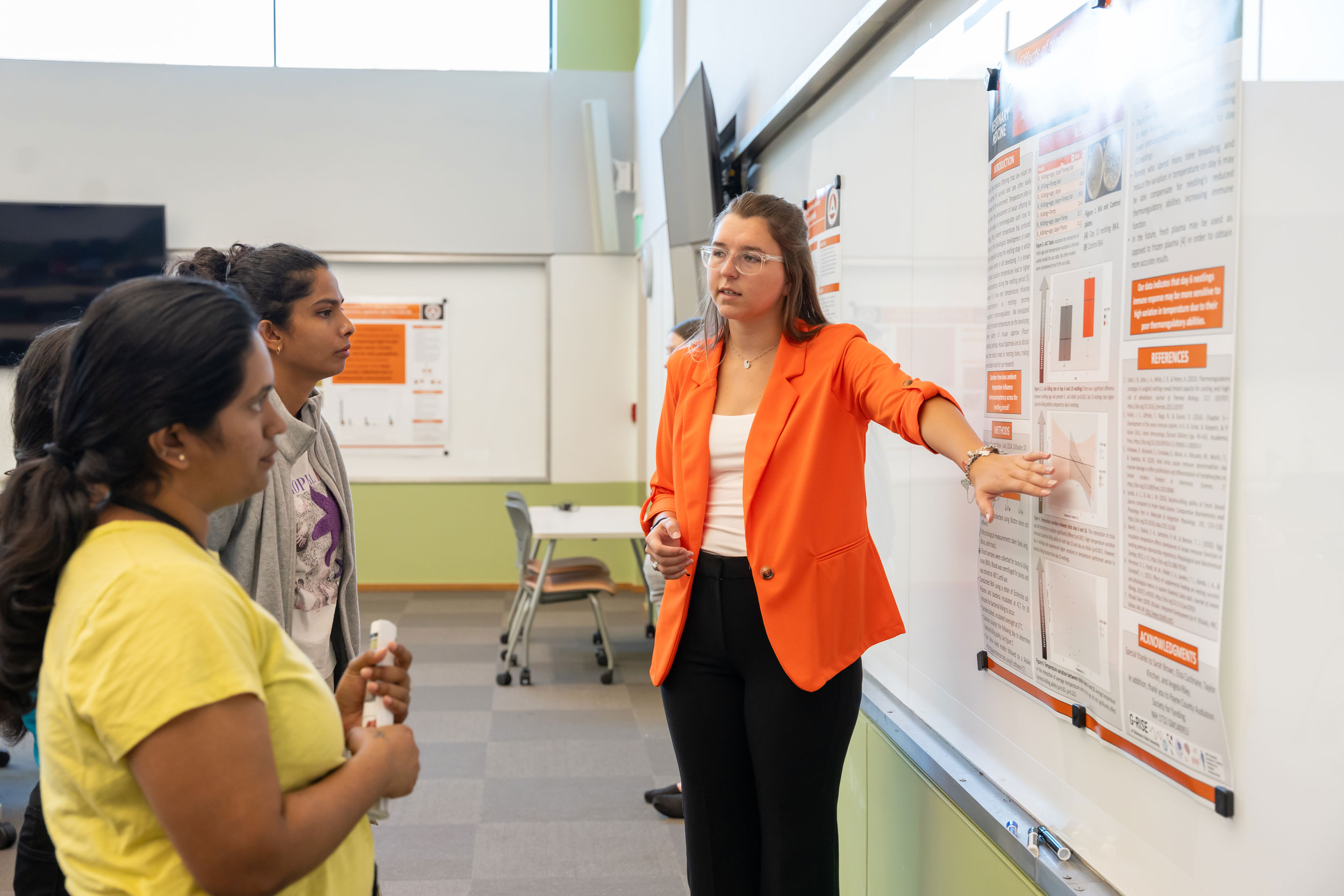Student making a presentation during VetMed Poster Day