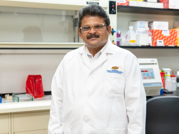 aravindan aravindan stands in lab
