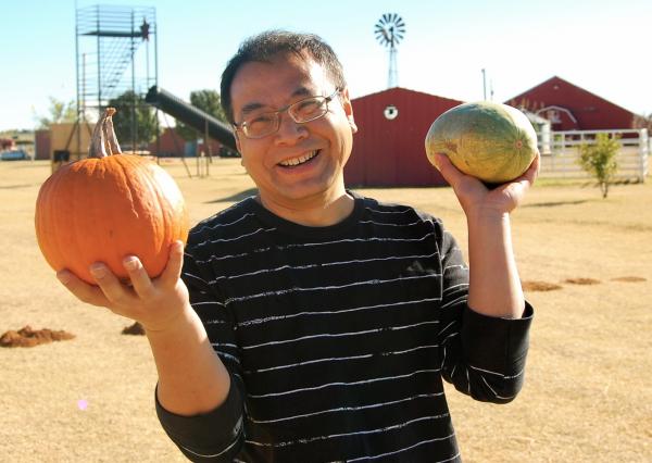 Dr. Lin Liu with pumpkins