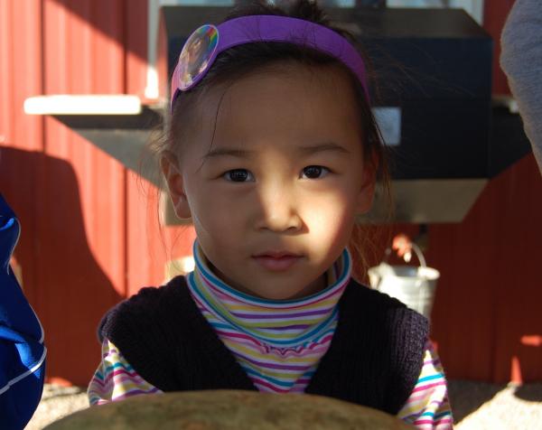 Little girl with purple bow