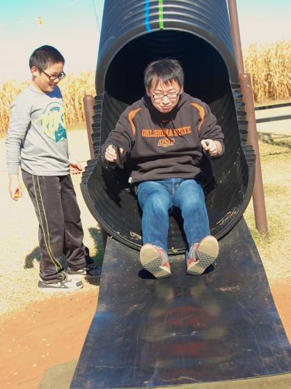 man going down a slide