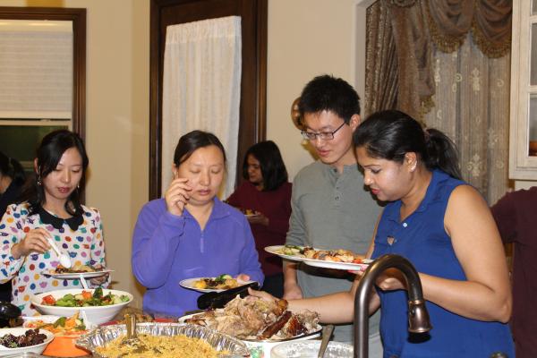 People getting plates of food