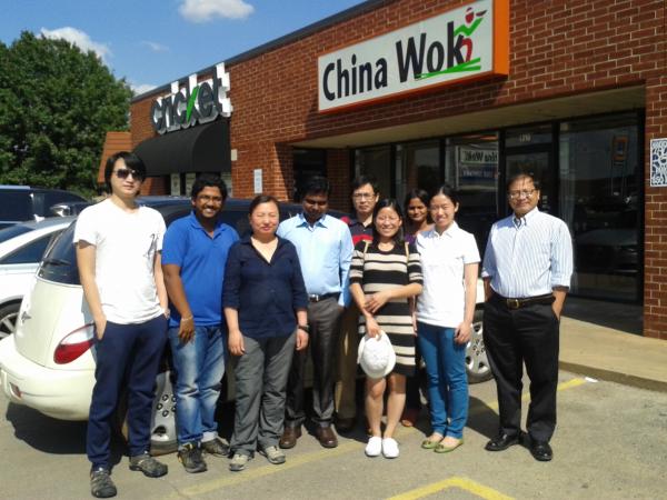 Lab members pose outside china wok restaurant