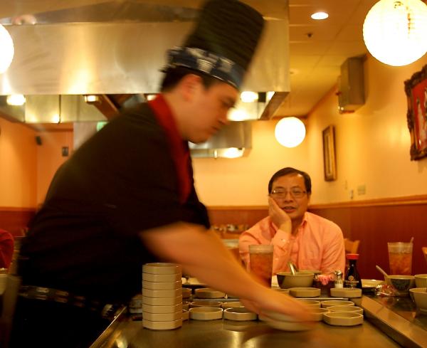 Dr. Lin Liu watches Hibatchi chef